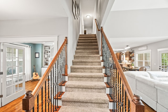 staircase with wood-type flooring