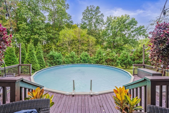 view of pool featuring a wooden deck