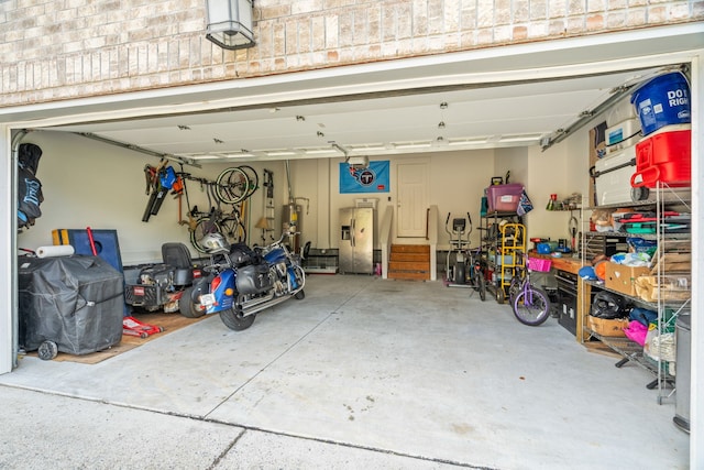 garage with stainless steel fridge with ice dispenser