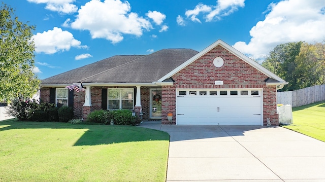 view of front of home featuring a garage and a front lawn