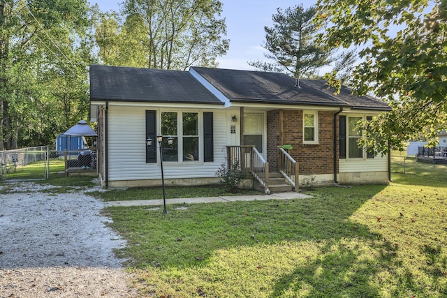 ranch-style house featuring a front lawn