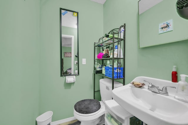 bathroom with sink and toilet