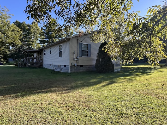 view of home's exterior featuring a lawn and central air condition unit