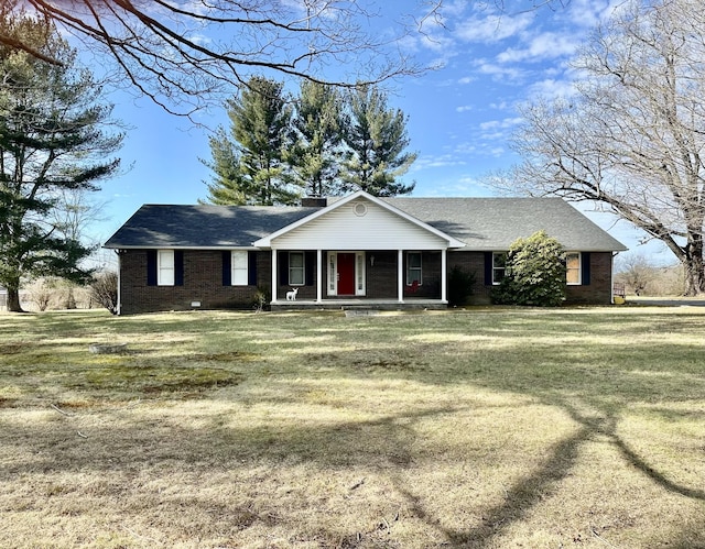 ranch-style house featuring a front yard and covered porch