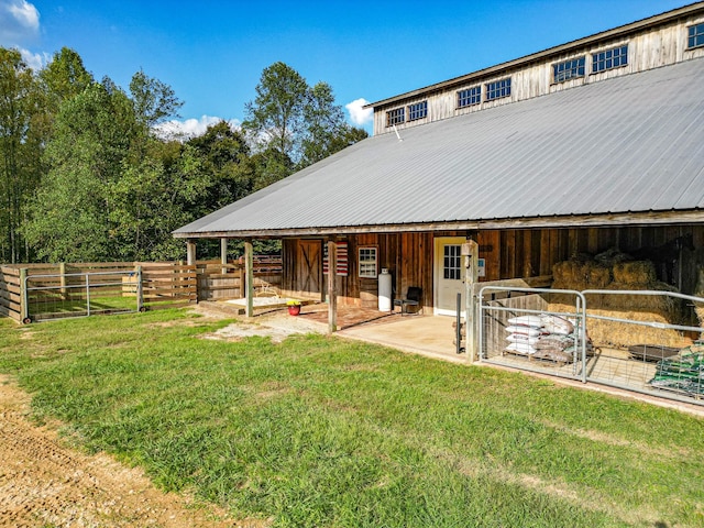 144 Abberly Ln, Hohenwald, TN 38462 - rear view of house with an exterior structure, an outdoor structure, and metal roof
