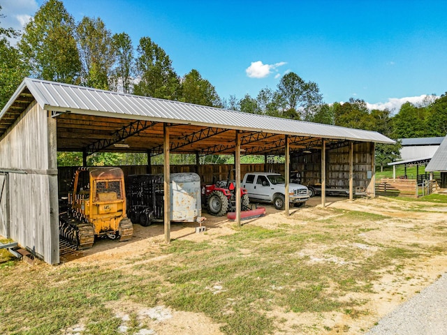 144 Abberly Ln, Hohenwald, TN 38462 - view of parking featuring a carport and an outbuilding