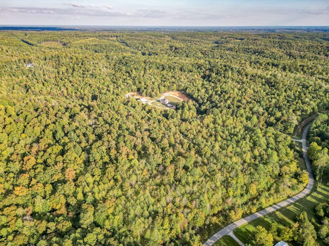 144 Abberly Ln, Hohenwald, TN 38462 - aerial view of property and surrounding area featuring a heavily wooded area