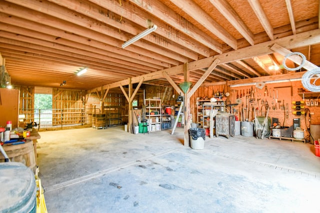 144 Abberly Ln, Hohenwald, TN 38462 - miscellaneous room with unfinished concrete floors and a workshop area