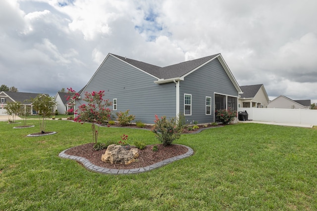 view of home's exterior with a yard