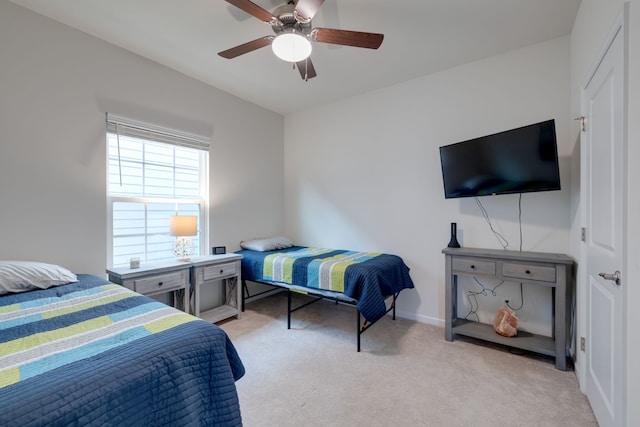 bedroom featuring ceiling fan and light colored carpet