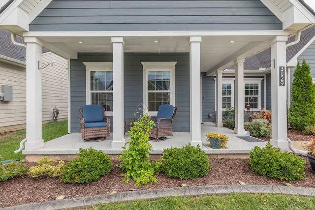 view of exterior entry with covered porch