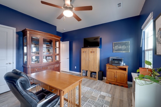 office featuring ceiling fan and light hardwood / wood-style flooring