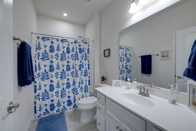 bathroom featuring tile patterned floors, curtained shower, vanity, and toilet