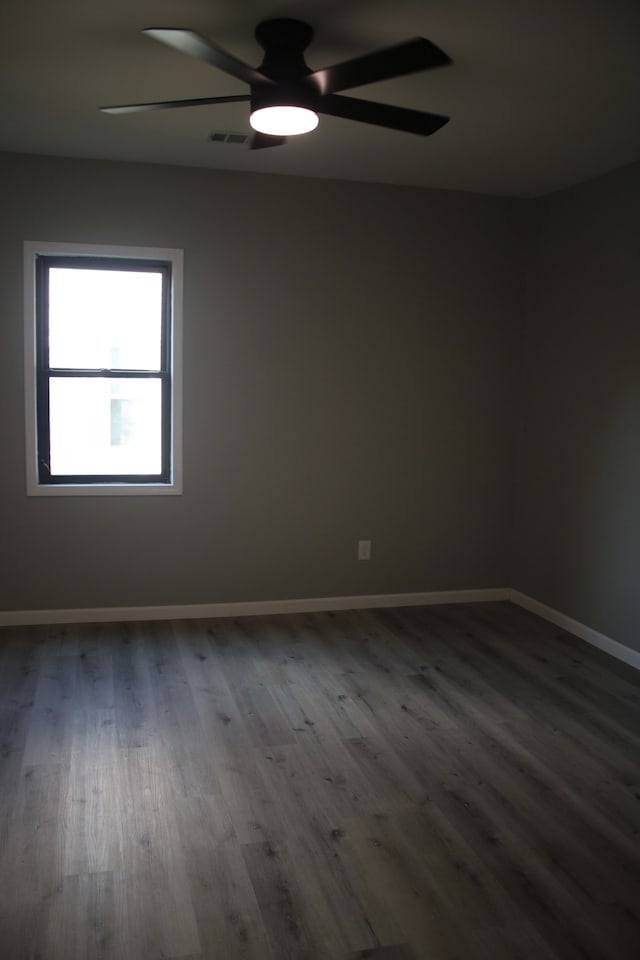 unfurnished room featuring ceiling fan and hardwood / wood-style floors