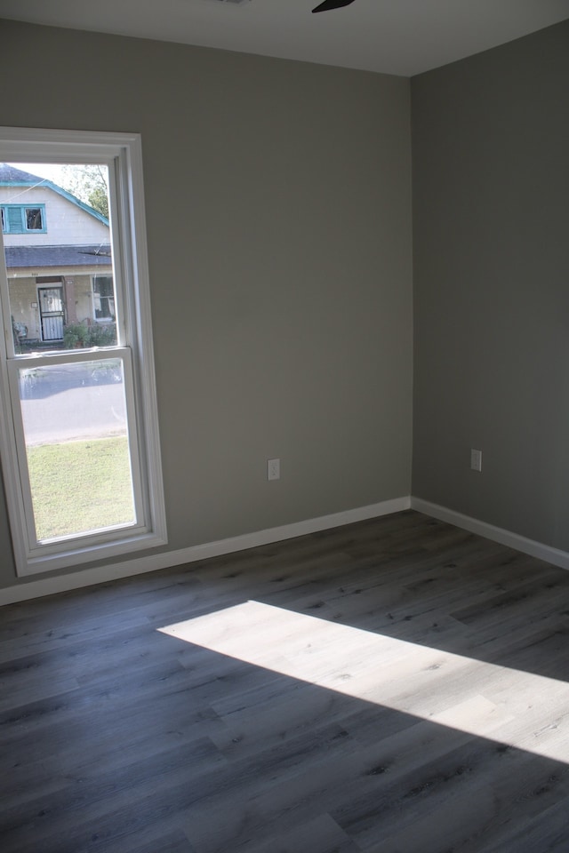 spare room with ceiling fan and hardwood / wood-style flooring