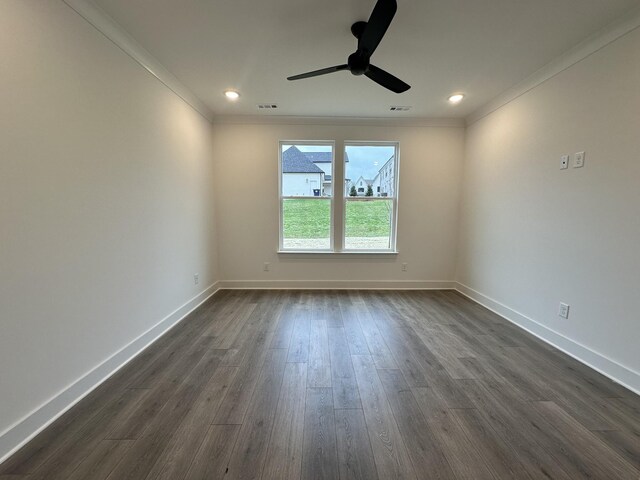 spare room featuring ceiling fan, crown molding, and dark hardwood / wood-style floors