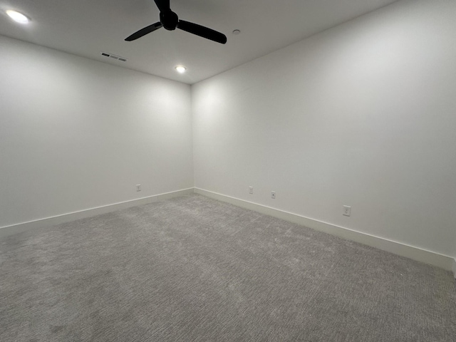 empty room with carpet flooring and ceiling fan