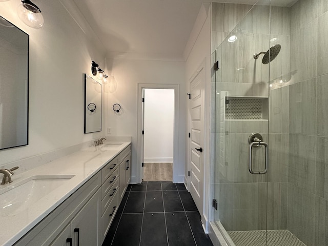 bathroom featuring tile patterned floors, vanity, and an enclosed shower