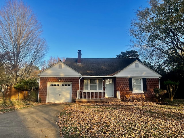 ranch-style house with a garage and covered porch