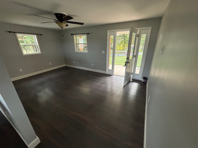 foyer with ceiling fan and dark wood-type flooring