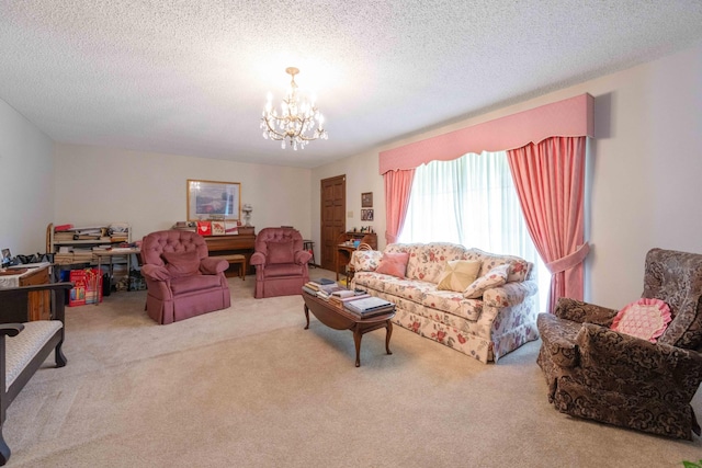living room featuring a textured ceiling, an inviting chandelier, and carpet floors