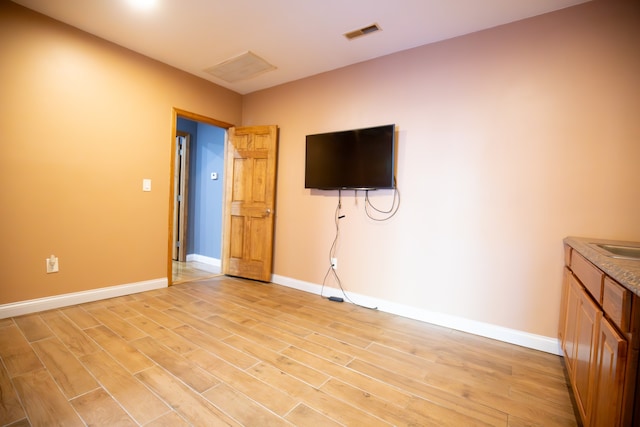 unfurnished living room featuring light hardwood / wood-style flooring