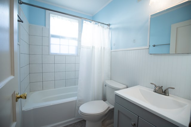 full bathroom with vanity, crown molding, shower / bathtub combination with curtain, and toilet