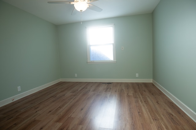 spare room featuring ceiling fan and wood-type flooring