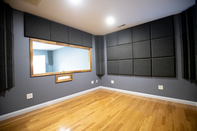 unfurnished room featuring hardwood / wood-style flooring