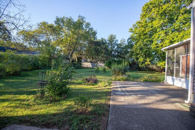 view of yard with a patio area and a sunroom