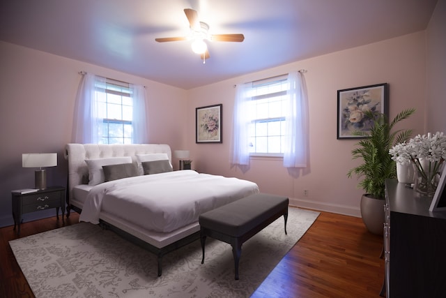 bedroom with ceiling fan and dark hardwood / wood-style flooring