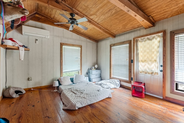 bedroom with vaulted ceiling with beams, light hardwood / wood-style flooring, and multiple windows