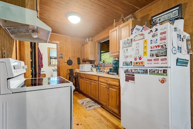 kitchen featuring light hardwood / wood-style flooring, white appliances, wood walls, and wooden ceiling