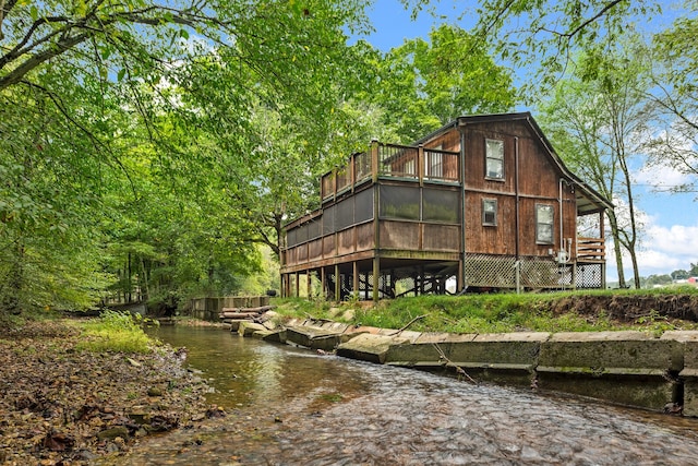 back of house with a water view