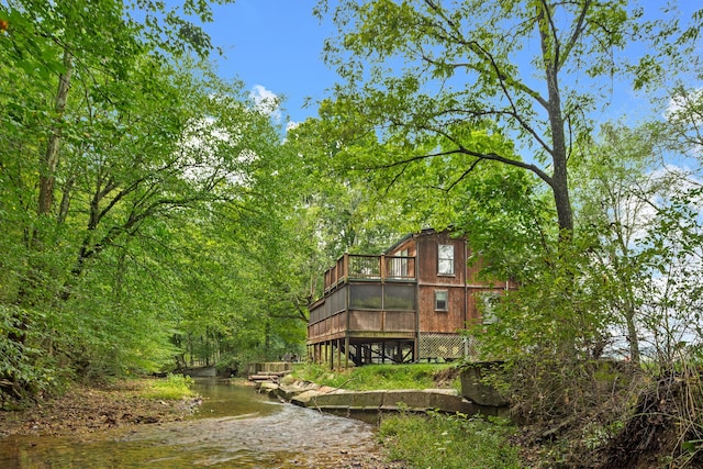 rear view of property featuring a water view