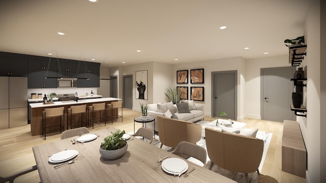 dining space featuring light hardwood / wood-style floors and sink