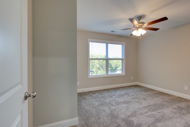 spare room with carpet and ceiling fan