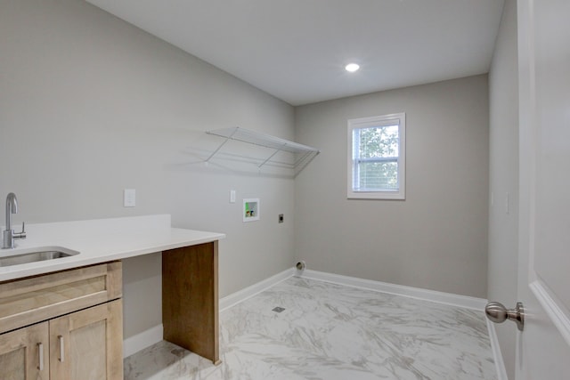 washroom with hookup for a washing machine, sink, electric dryer hookup, and cabinets