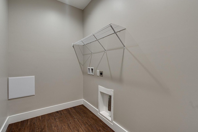 laundry room featuring laundry area, hookup for a washing machine, baseboards, electric dryer hookup, and dark wood-type flooring