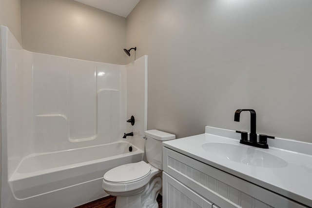 full bathroom with vanity, bathing tub / shower combination, toilet, and wood finished floors