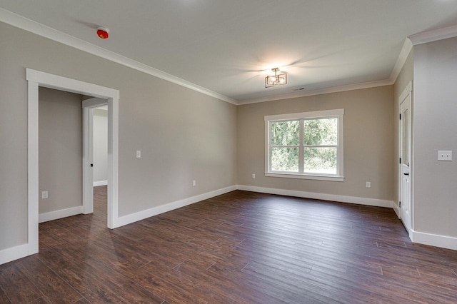 spare room with crown molding and dark hardwood / wood-style flooring