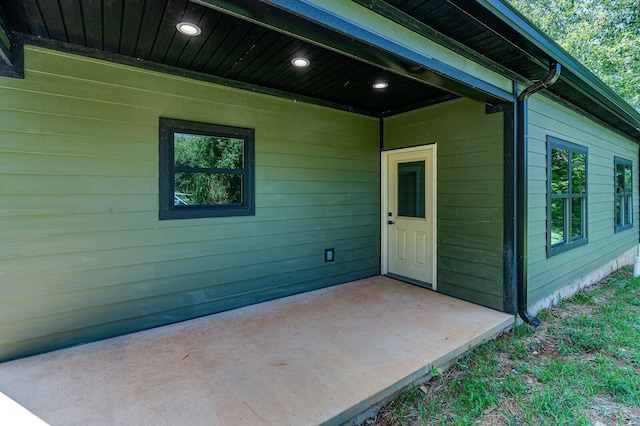 property entrance with a patio area