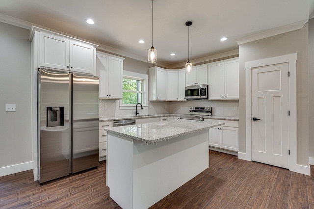 kitchen with crown molding, stainless steel appliances, white cabinetry, and dark wood-type flooring