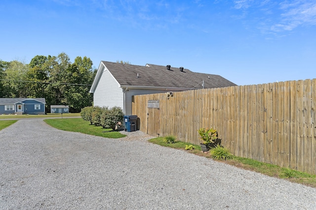 view of home's exterior with a lawn