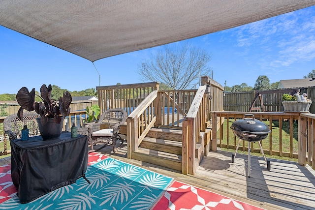 wooden deck featuring area for grilling