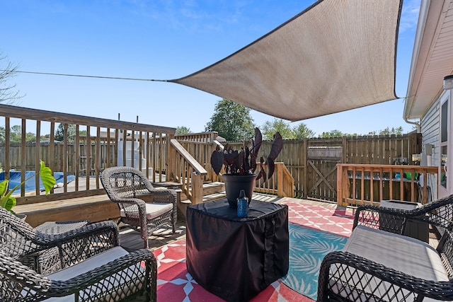 wooden terrace featuring a patio area