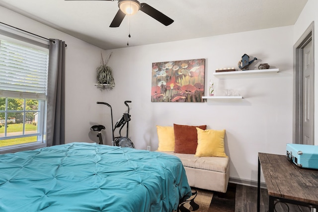 bedroom with ceiling fan and hardwood / wood-style flooring