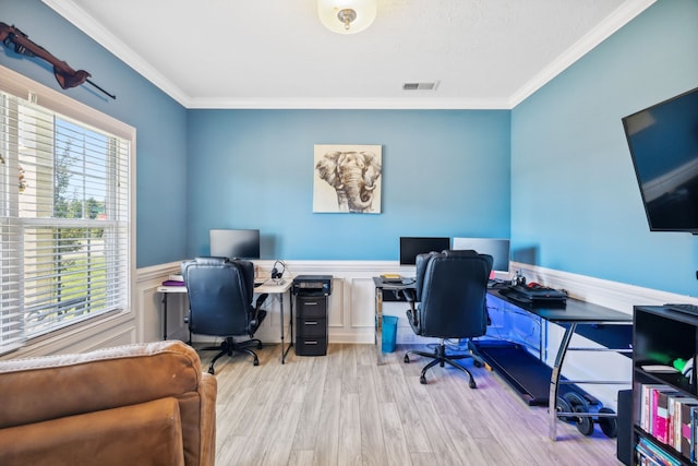 office area featuring ornamental molding and light hardwood / wood-style flooring