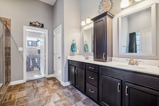 bathroom with vanity and a shower with shower door