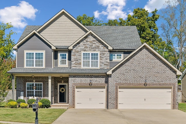 view of front facade with a garage and a front lawn